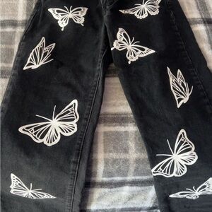 SHEIN Black Jeans with White Butterfly Design